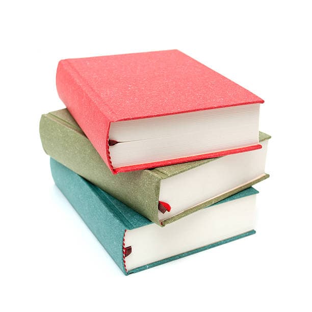 red, green, and blue books stacked on white background